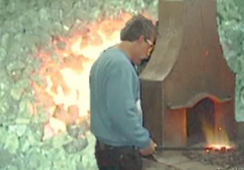  Steve working at his forge on a rowing frame for a raft